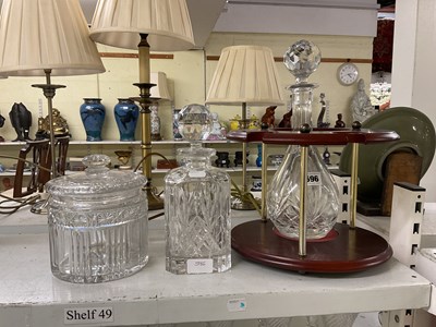 Lot 596 - Two glass decanters, one with stand, height of...