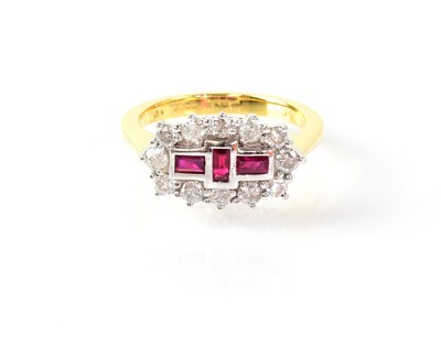 Lot 839 - An 18ct yellow gold ring set with three...