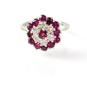 Lot 827 - An 18ct white gold cluster ring set with...