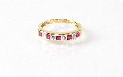 Lot 868 - A 9ct gold half eternity ring set with...
