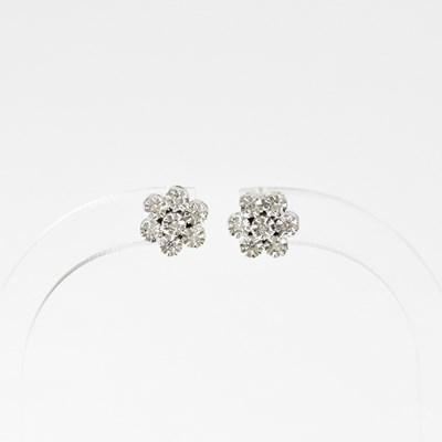 Lot 964 - A pair of 18ct white gold diamond earrings in...