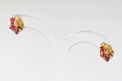 Lot 971 - A pair of yellow metal stud earrings set with...