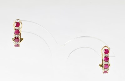 Lot 966 - A pair of 9ct gold stud earrings,...