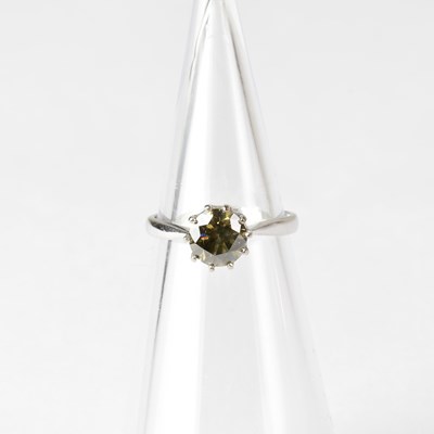 Lot 817 - An 18ct white gold solitaire ring set with...