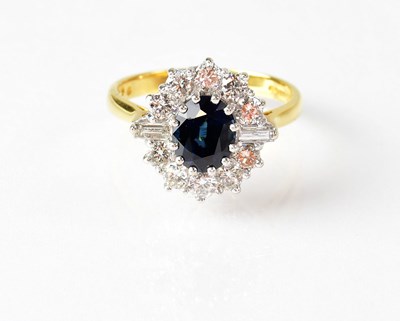 Lot 823 - An 18ct yellow gold cluster ring set with...
