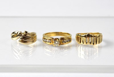 Lot 903 - Three rings comprising a yellow metal example...