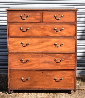 Lot 111 - A Georgian mahogany chest of two short and...