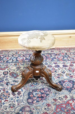 Lot 2568 - A Victorian carved walnut piano stool, height...