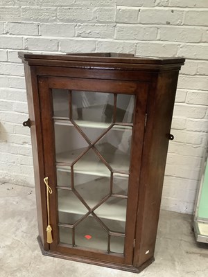 Lot 2396 - A Georgian oak wall hanging corner cupboard,...