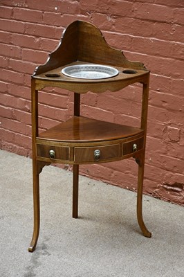 Lot 2564 - A Georgian mahogany corner washstand, with...