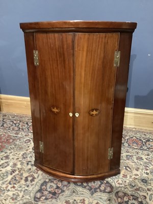 Lot 2507 - A 19th century inlaid mahogany corner cupboard,...