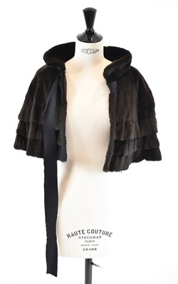 Lot 9 - LOUIS VUITTON; a brown sheepskin fur cape,...