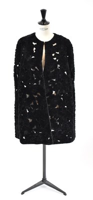 Lot 10 - ELIE SAAB; a black 100% shearling floral cape,...