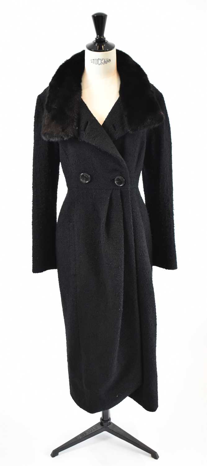 Lot 13 - CHRISTIAN DIOR; a black wool mix full length...