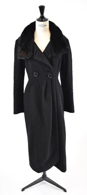 Lot 13 - CHRISTIAN DIOR; a black wool mix full length...