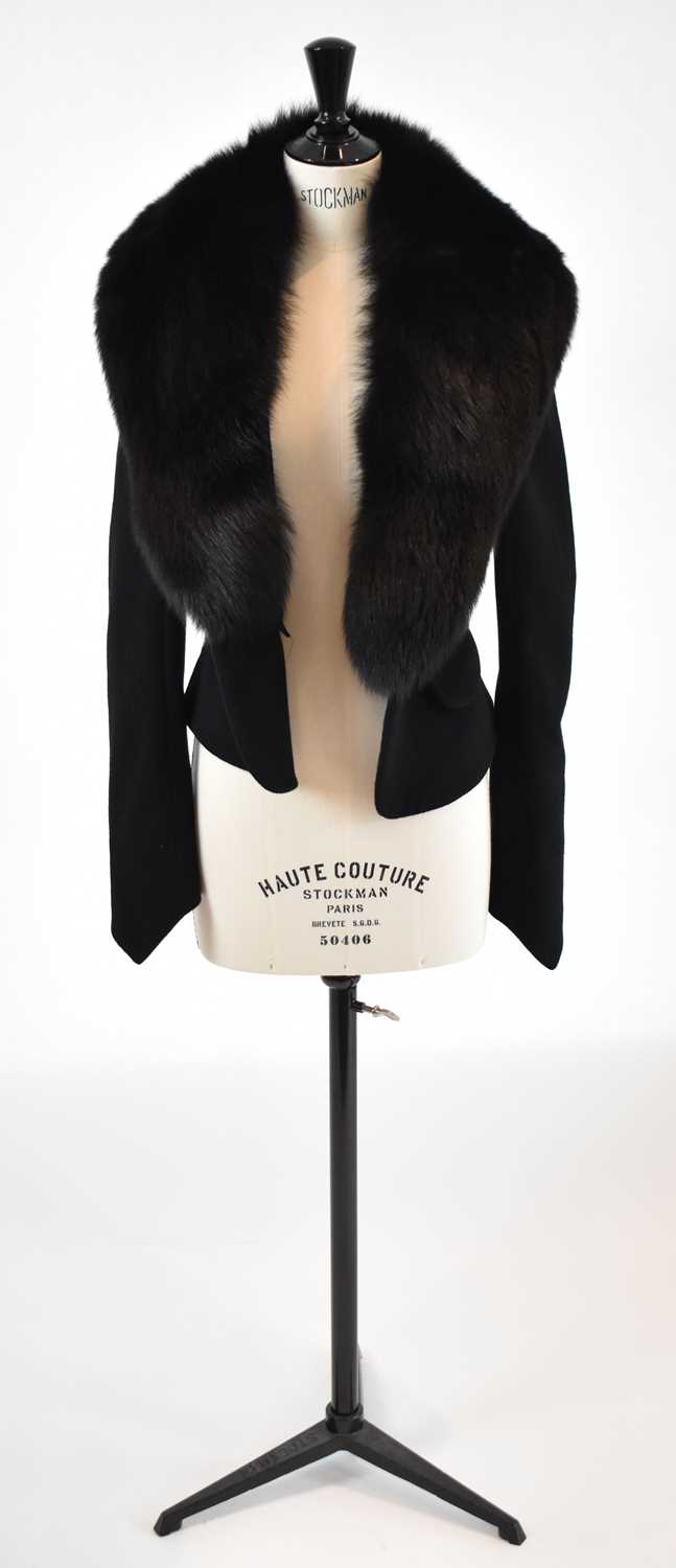 Lot 18 - GIVENCHY; a black wool short fitted jacket...