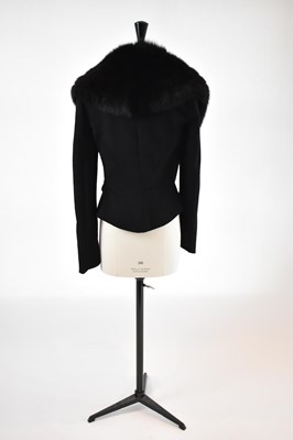 Lot 18 - GIVENCHY; a black wool short fitted jacket...