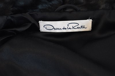 Lot 20 - OSCAR DE LA RENTA; a black short fur full...