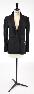 Lot 22 - GUCCI; a dark grey wool mix fitted blazer,...