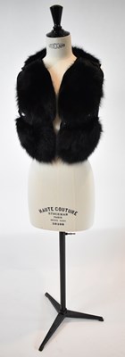 Lot 28 - LANVIN; a black short fox fur gilet, size 40.
