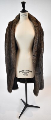 Lot 31 - A brown full length fur coat, size 38.