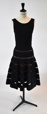 Lot 37 - ALAIA; a black 100% wool midi length evening...