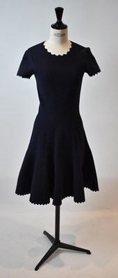 Lot 49 - ALAIA; a navy blue wool mix short sleeve...