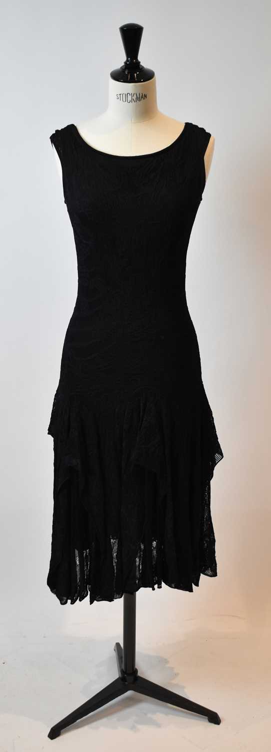 Lot 59 - ALEXANDER MCQUEEN; a black silk lace short...