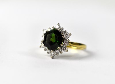 Lot 1011 - An 18ct yellow gold diamond and tourmaline ring