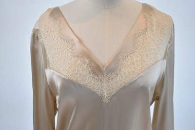 Lot 84 - CHRISTIES A PORTER; a beige 100% silk and...