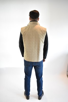 Lot 104 - LORO PIANA; an ecru Storm System quilted gilet,...