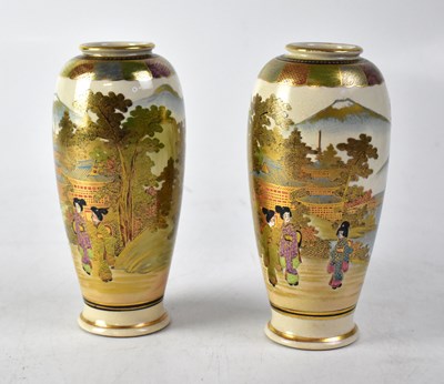 Lot 410 - A pair of Meiji period Satsuma slender baluster vases