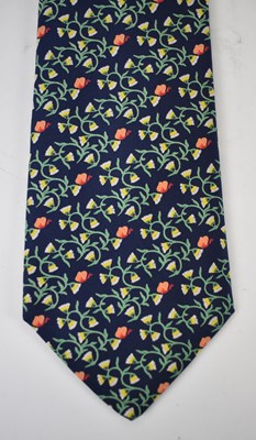 Lot 444 - HERMES; a 100% silk blue tie with orange and...