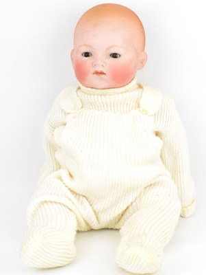Lot 239 - An early 20th century bisque head doll with sleepy eyes
