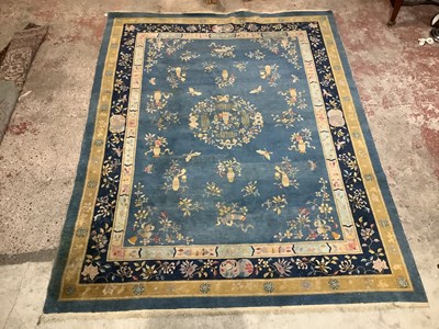 Lot 2277 - A blue ground Chinese carpet. 356x271cm