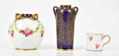 Lot 2237 - ROYAL DOULTON; a small globular vase painted...