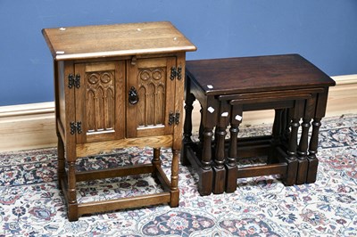 Lot 2665 - An oak side cabinet, the twin doors with...