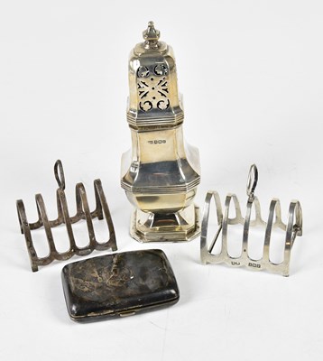 Lot 2680 - A hallmarked silver sugar caster, two toast...