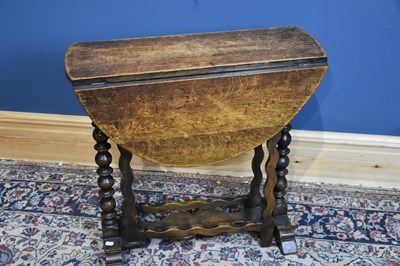 Lot 6638 - A 19th century oak drop-leaf side table with...