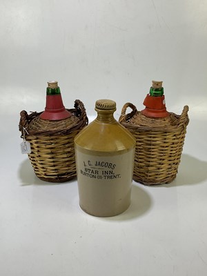 Lot 5102 - A stoneware flagon, together with two bottles...