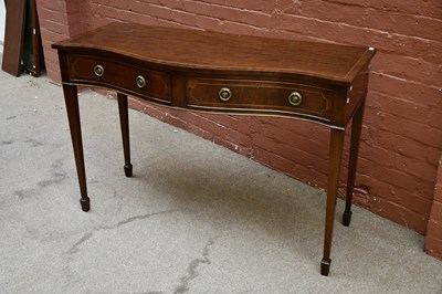 Lot 2647 - A reproduction mahogany serpentine hall table,...