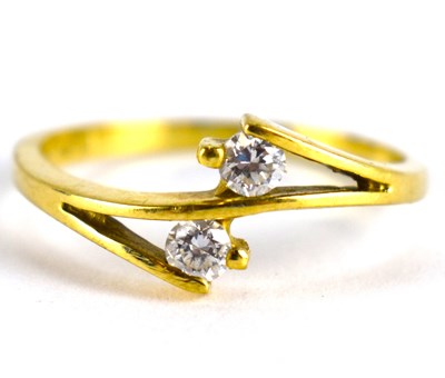 Lot 851 - A 14ct gold dress ring with two cross-over...