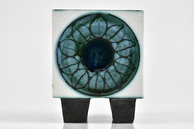 Lot 42 - TROIKA; an early four footed cube, each side...