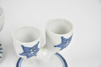Lot 32 - TROIKA POTTERY; three double egg cups, to...