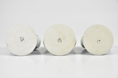 Lot 32 - TROIKA POTTERY; three double egg cups, to...