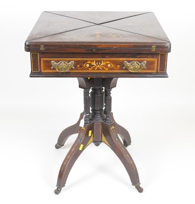 Lot 67 - A Victorian rosewood envelope table with small...