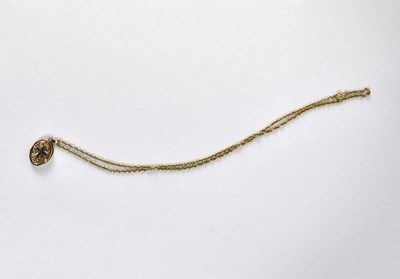 Lot 968 - A 9ct yellow gold oval locket
