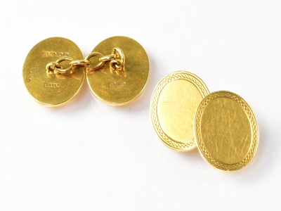 Lot 976 - A pair of 18ct gold cufflinks of oval form,...