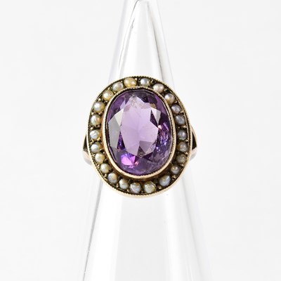 Lot 863 - A 9ct gold ring set with an oval amethyst in a...