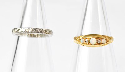 Lot 899 - Four various rings, comprising two 9ct gold...